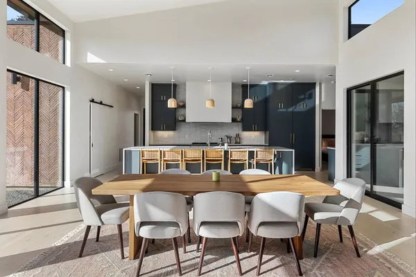 a kitchen with stainless steel appliances granite countertop a stove and a refrigerator