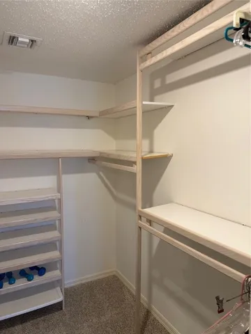 a view of an empty walk in closet