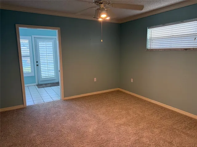 an empty room with a empty space and a window