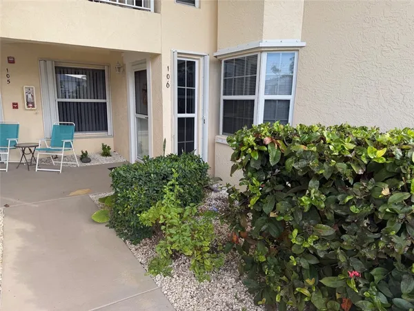front view of a house with potted plants