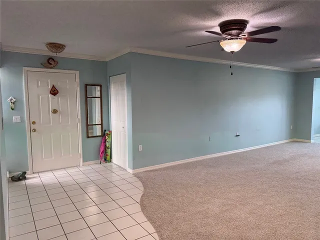 a view of a livingroom with a ceiling fan