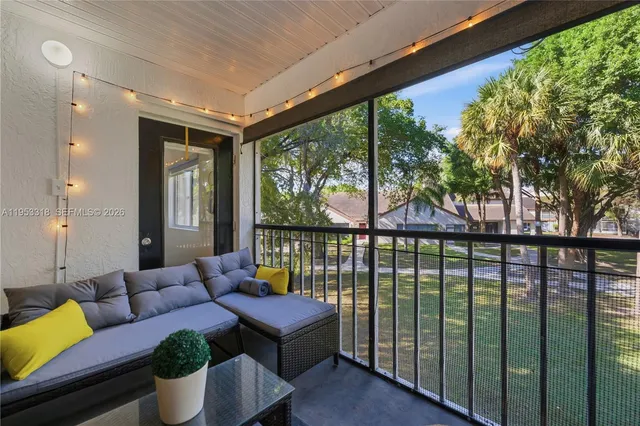 a outdoor living space with furniture and garden view