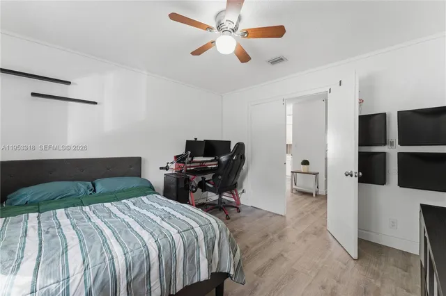 a bedroom with a bed and a chair