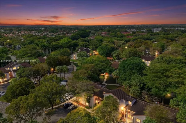 an aerial view of a house with a yard lake view and mountain view