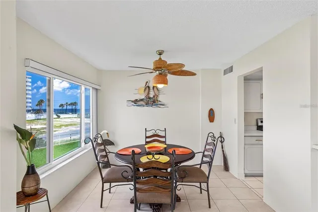 a view of a dining room with furniture window and outside view