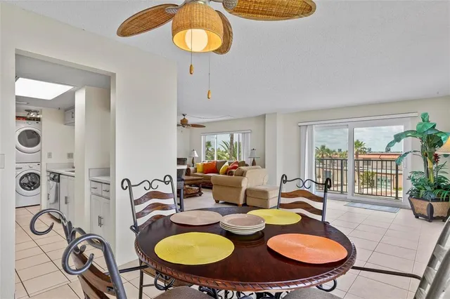 a dining room with furniture a window and wooden floor