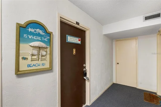 a view of front door with wooden floor