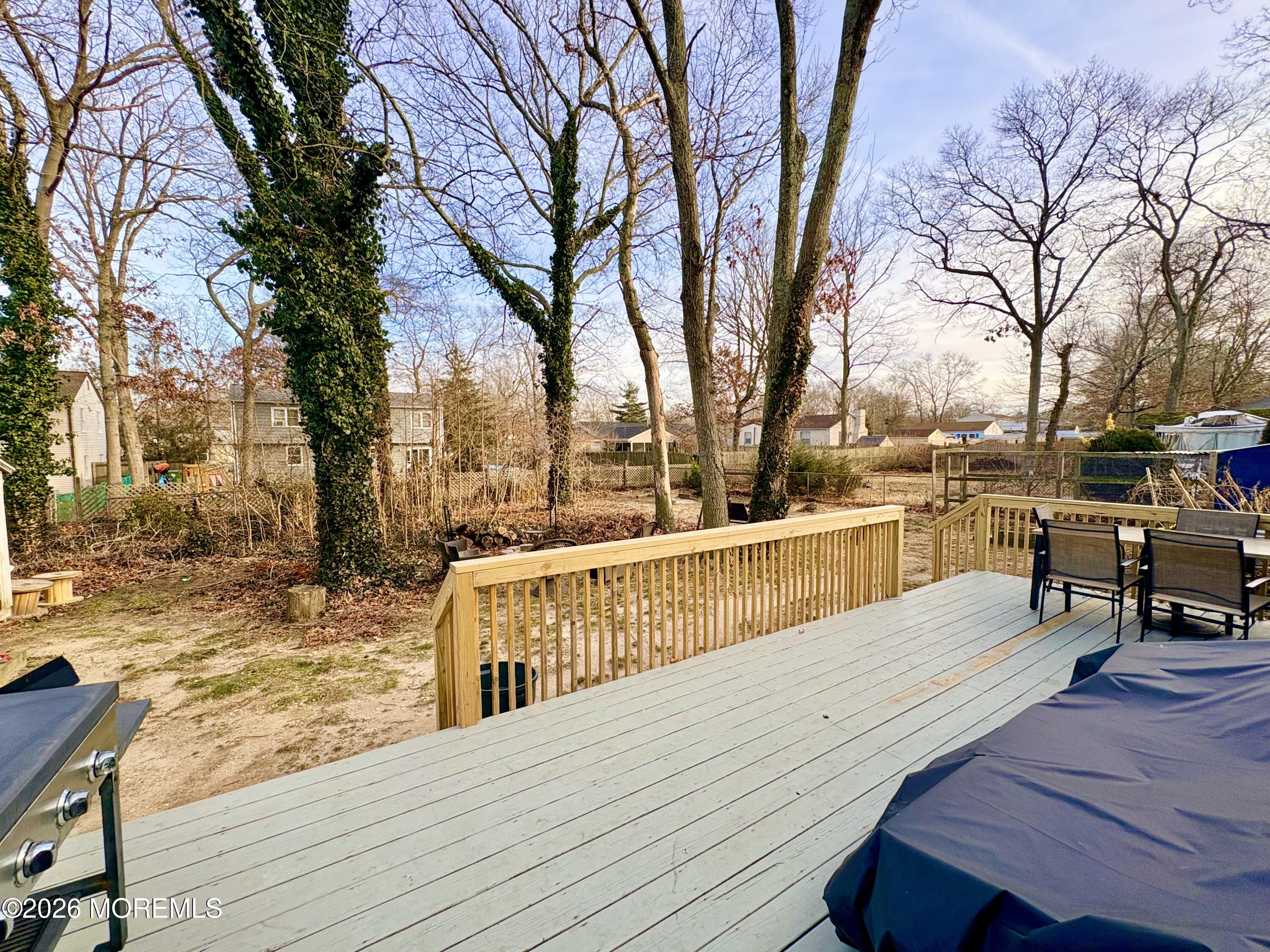 25 Chain Boulevard Bayville, NJ 08721 - Photo 14 of 17 Large deck overseeing spacious backyard