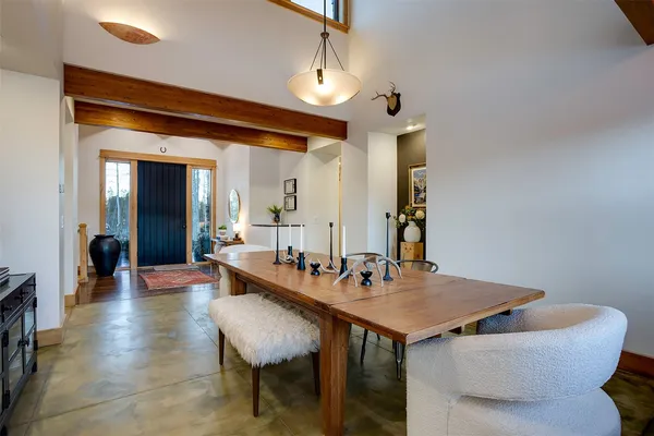 a dining room with a table and chairs