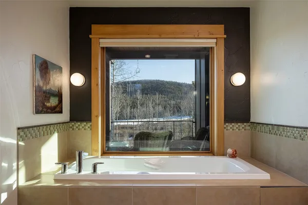 a bathroom with a bathtub and a sink