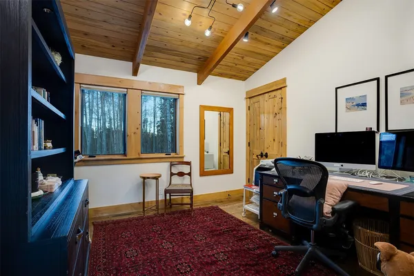 a workspace with furniture hardwood and a window