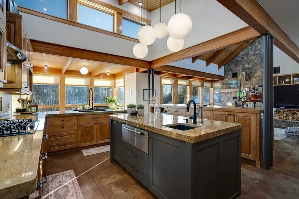 a kitchen with stainless steel appliances granite countertop a sink and cabinets
