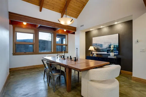 a dining room with furniture and window