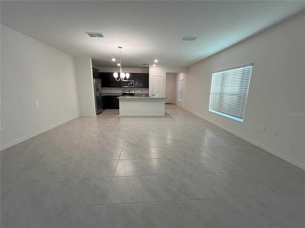 758 Stoney Point Circle Davenport, FL 33896 - Photo 12 of 42 a view of a kitchen with a sink and cabinets