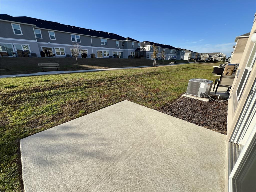 758 Stoney Point Circle Davenport, FL 33896 - Photo 14 of 42 a view of a house with a yard