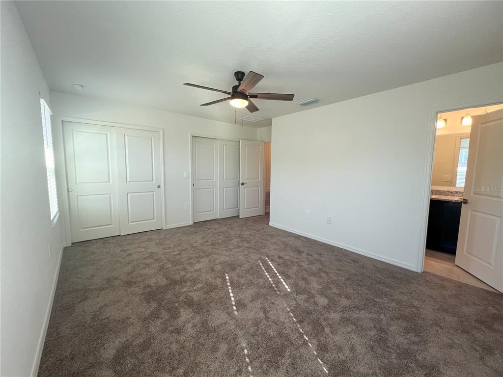 758 Stoney Point Circle Davenport, FL 33896 - Photo 36 of 42 wooden floor in an empty room