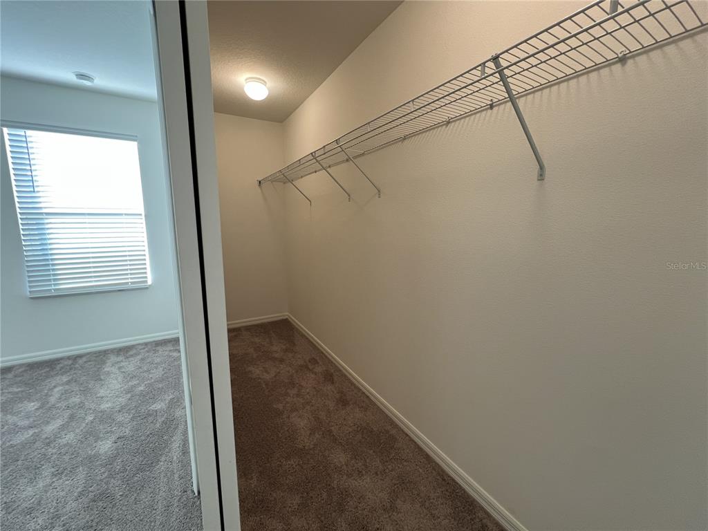 758 Stoney Point Circle Davenport, FL 33896 - Photo 37 of 42 a view of hallway with window