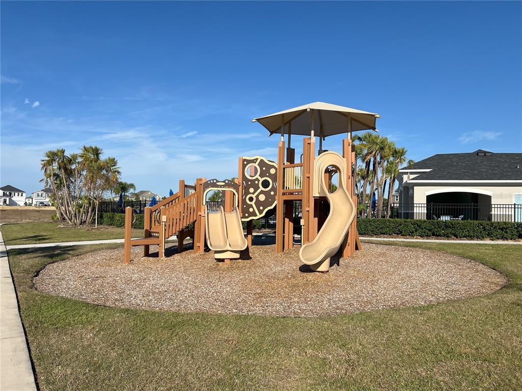 758 Stoney Point Circle Davenport, FL 33896 - Photo 40 of 42 a view of a park with slide