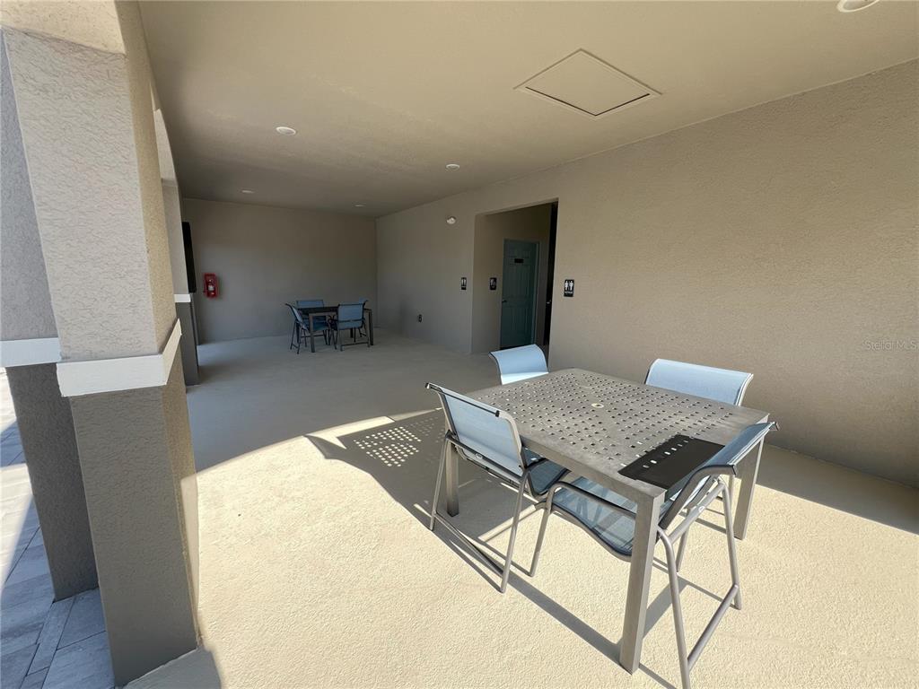 758 Stoney Point Circle Davenport, FL 33896 - Photo 42 of 42 a workspace with furniture and wooden floor