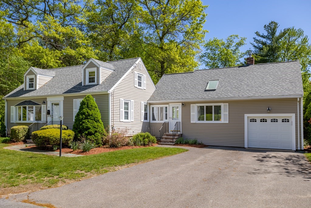 3 Walnut Road Chelmsford, MA 01824 - Photo 1 of 1 a front view of a house with a yard and garage