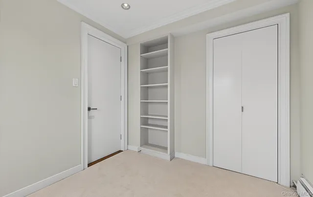 a view of an empty room and closet