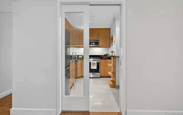 a view of a kitchen from the hallway