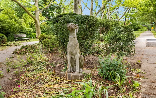 a view of street with sitting area and umbrellas