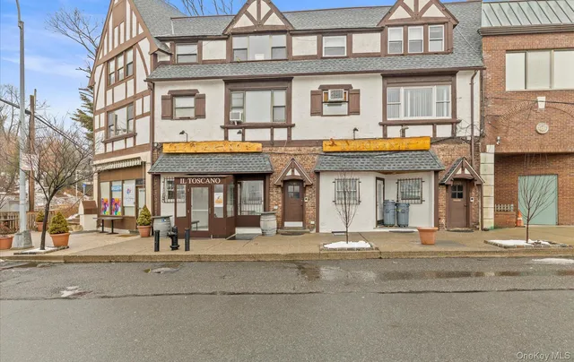 a sign on the side of the tree