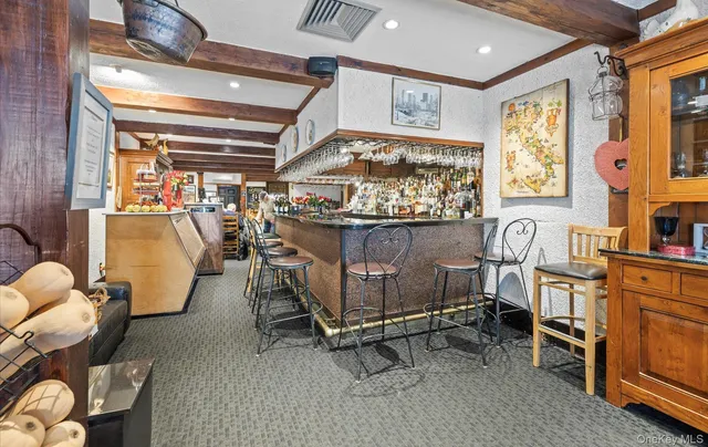 an aerial view of a house with swimming pool patio and lake view