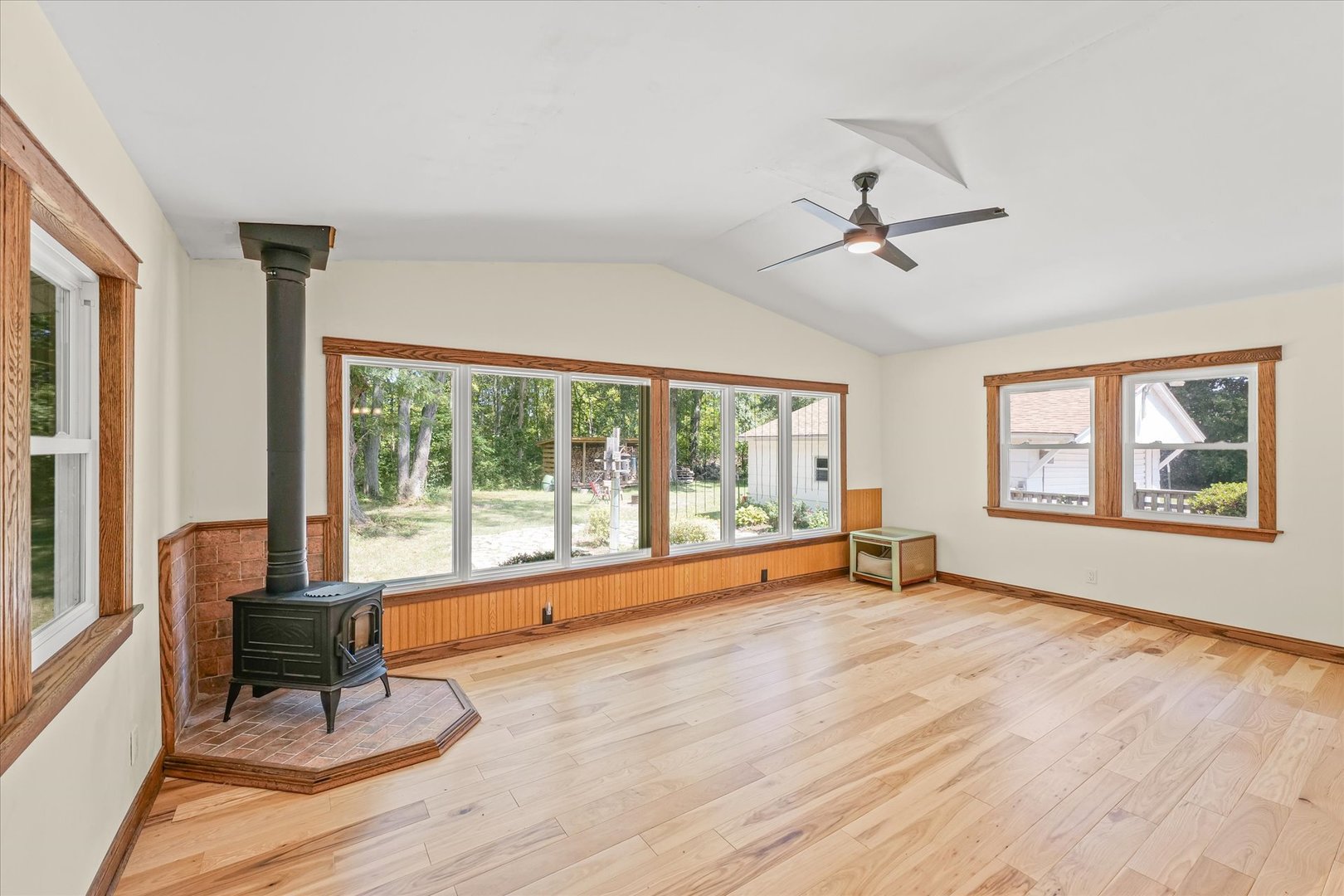 9835 East 1610 North Road Oakwood, IL 61858 - Photo 13 of 35 a view of an empty room with a window and wooden floor