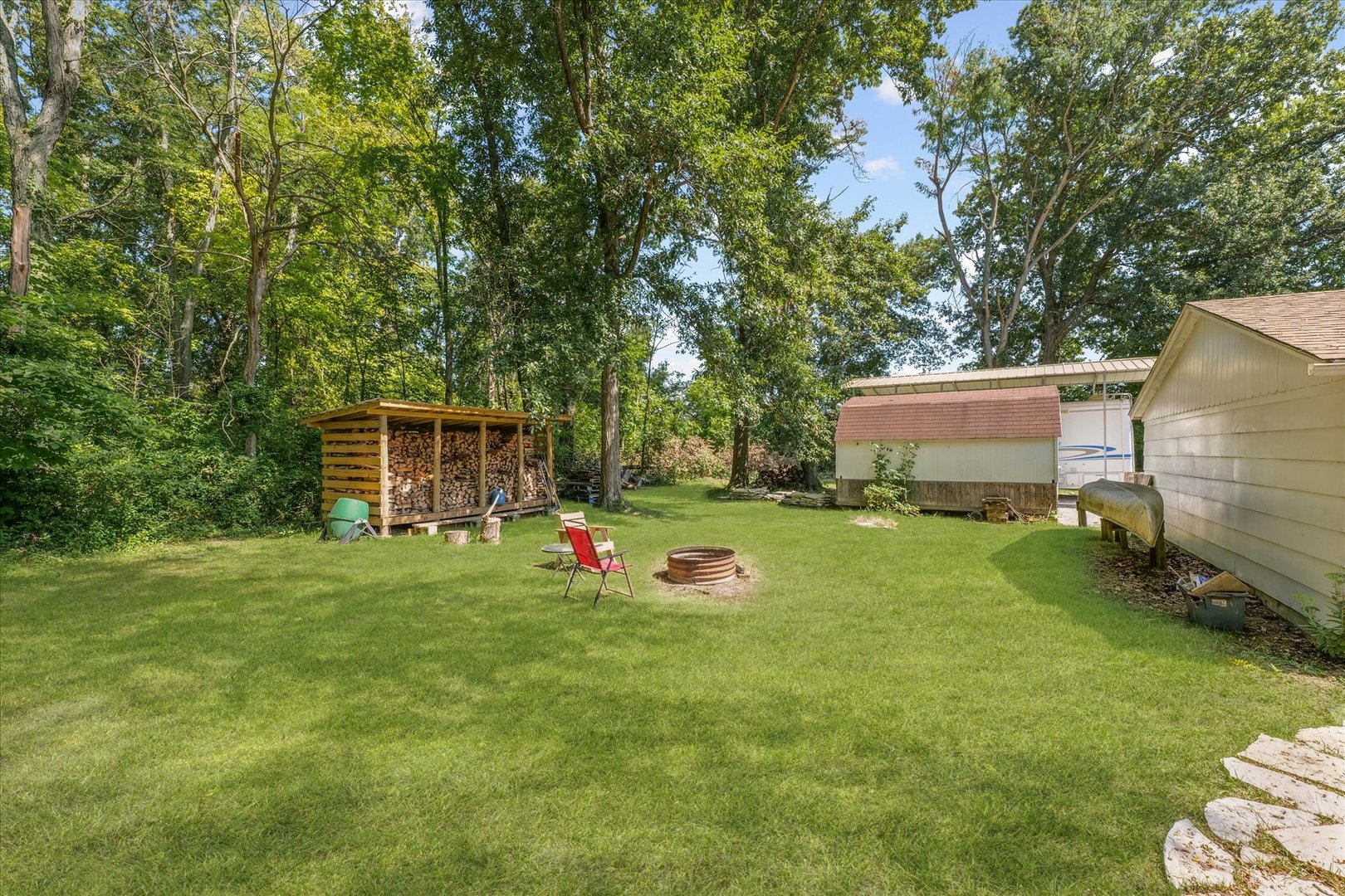 9835 East 1610 North Road Oakwood, IL 61858 - Photo 31 of 35 a front view of a house with garden