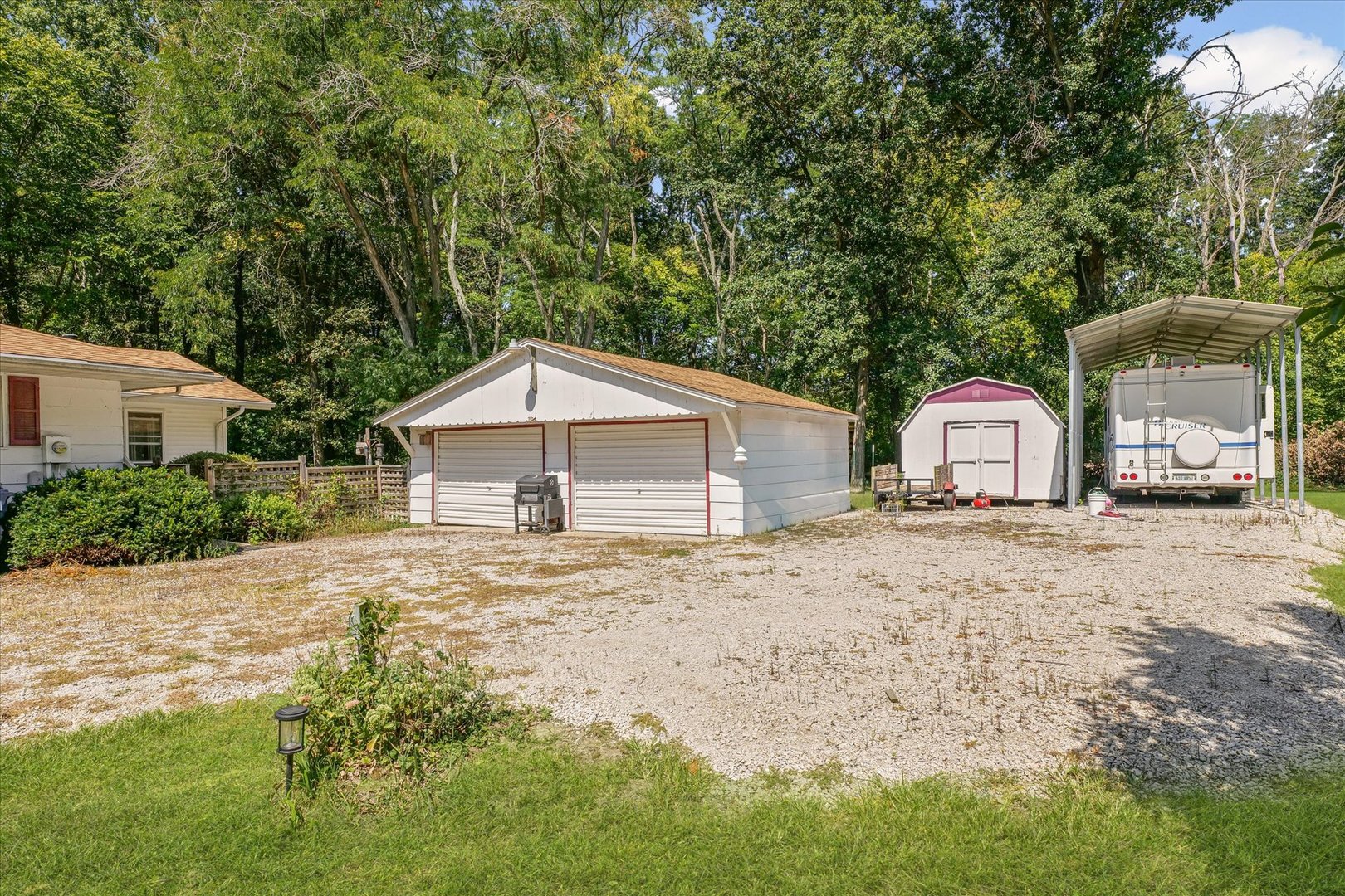 9835 East 1610 North Road Oakwood, IL 61858 - Photo 33 of 35 a front view of a house with a yard and large tree