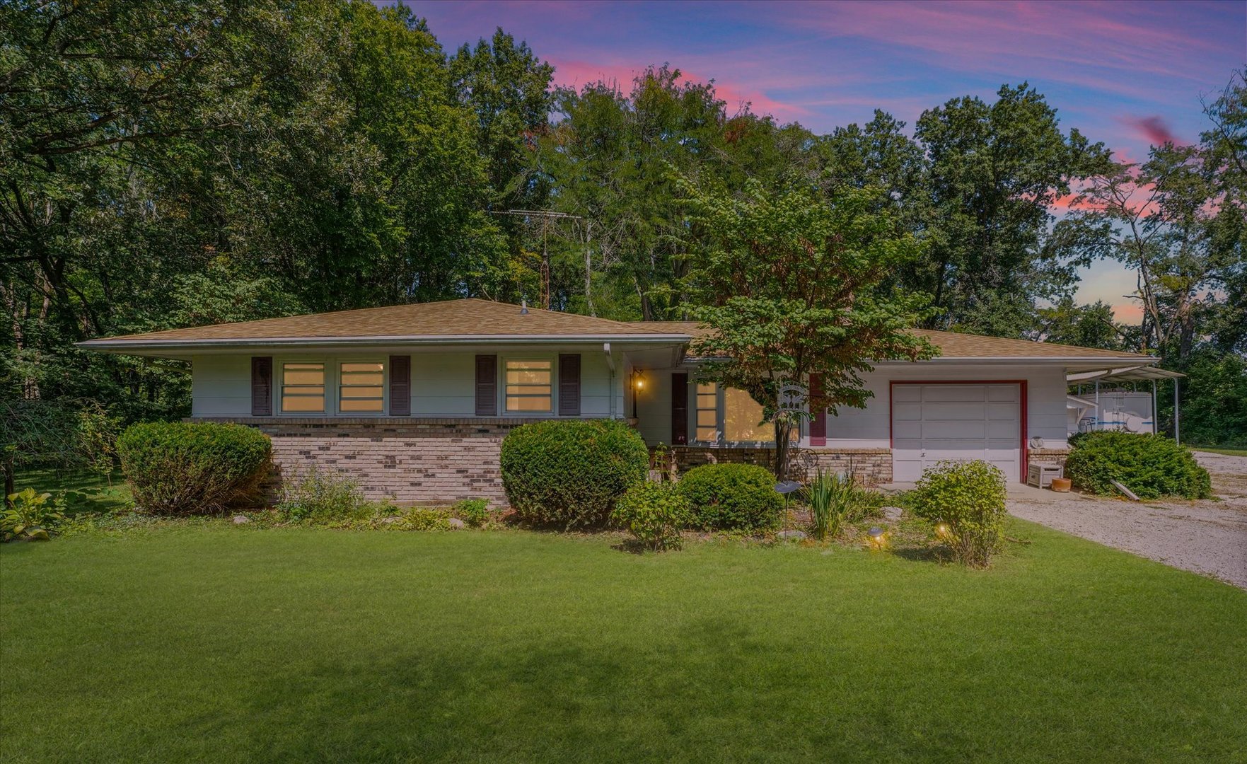 9835 East 1610 North Road Oakwood, IL 61858 - Photo 34 of 35 a front view of a house with a yard and trees