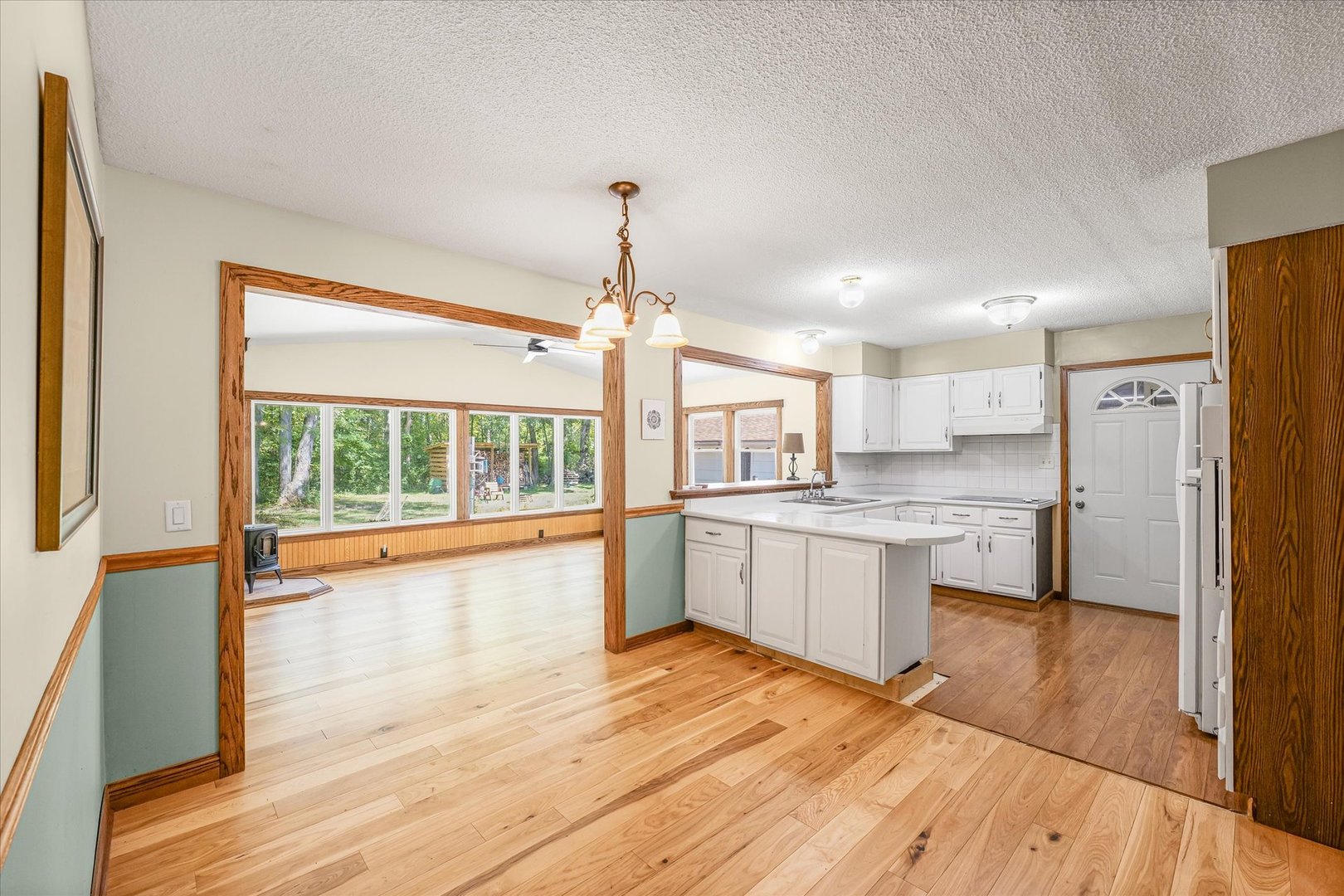 9835 East 1610 North Road Oakwood, IL 61858 - Photo 8 of 35 a large kitchen with a wooden floor and a large window