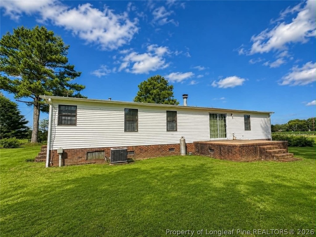 4435 Tartt's Mill Road Wilson, NC 27893 - Photo 16 of 23 a front view of house with yard and outdoor seating
