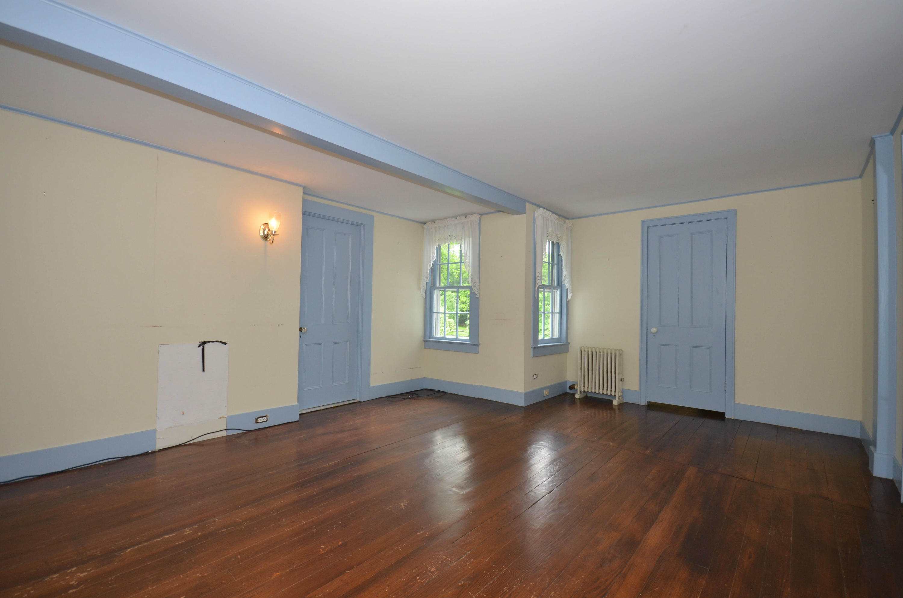 1462 Oenoke Ridge New Canaan, CT 06840 - Photo 14 of 25 a view of an empty room with wooden floor and a window