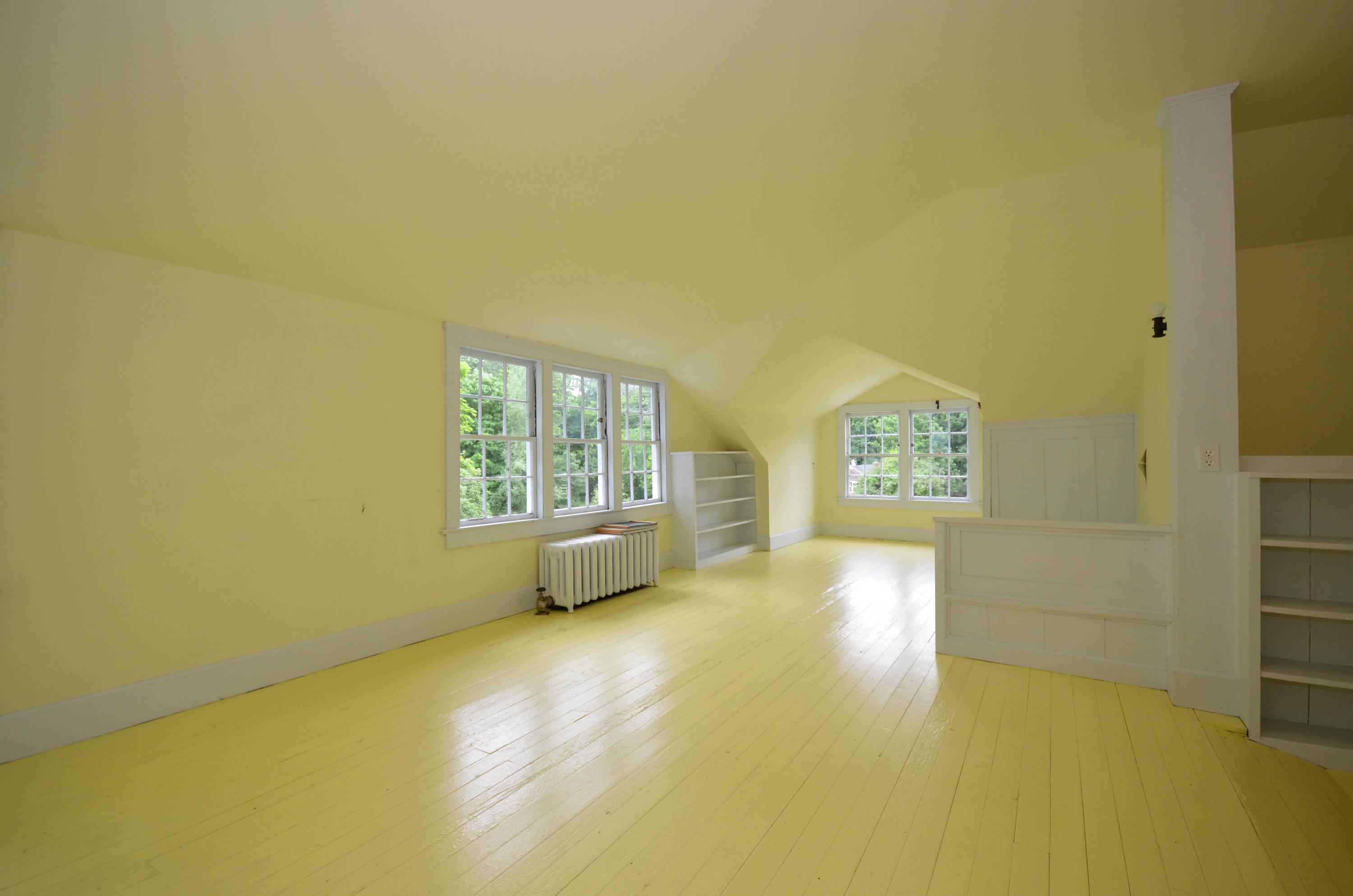 1462 Oenoke Ridge New Canaan, CT 06840 - Photo 16 of 25 a view of an empty room with a window and wooden floor