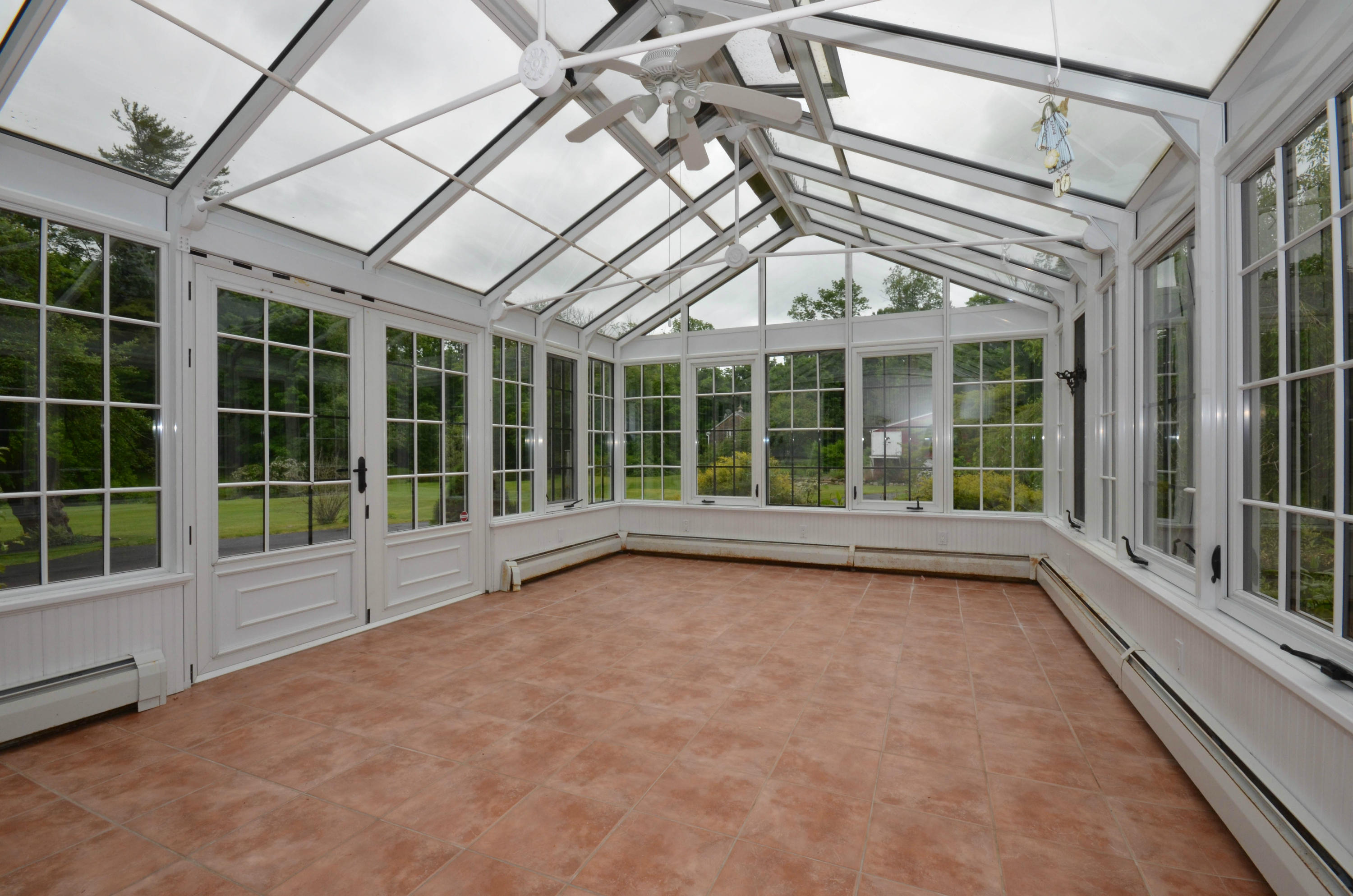 1462 Oenoke Ridge New Canaan, CT 06840 - Photo 17 of 25 a view of an empty room with a balcony