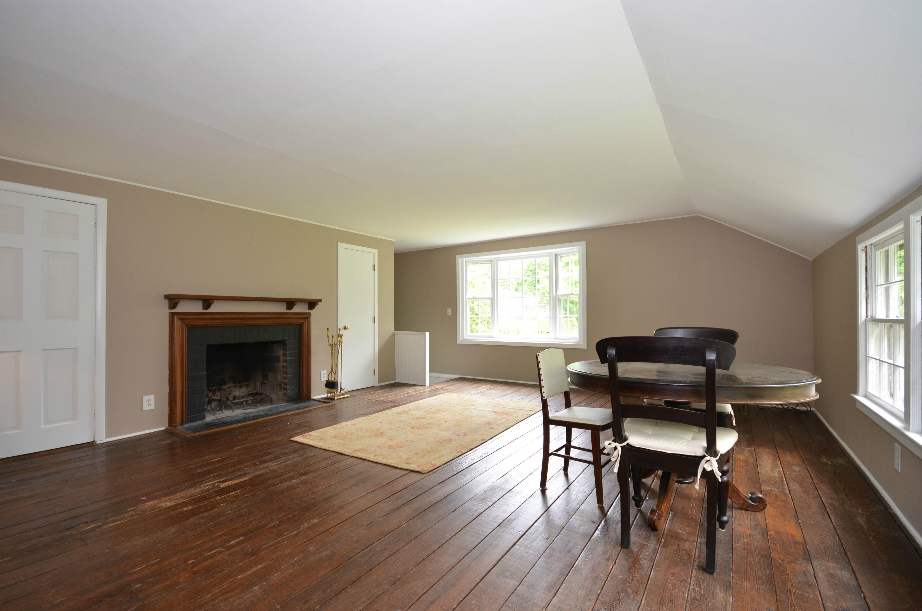 1462 Oenoke Ridge New Canaan, CT 06840 - Photo 19 of 25 a living room with furniture and a fireplace