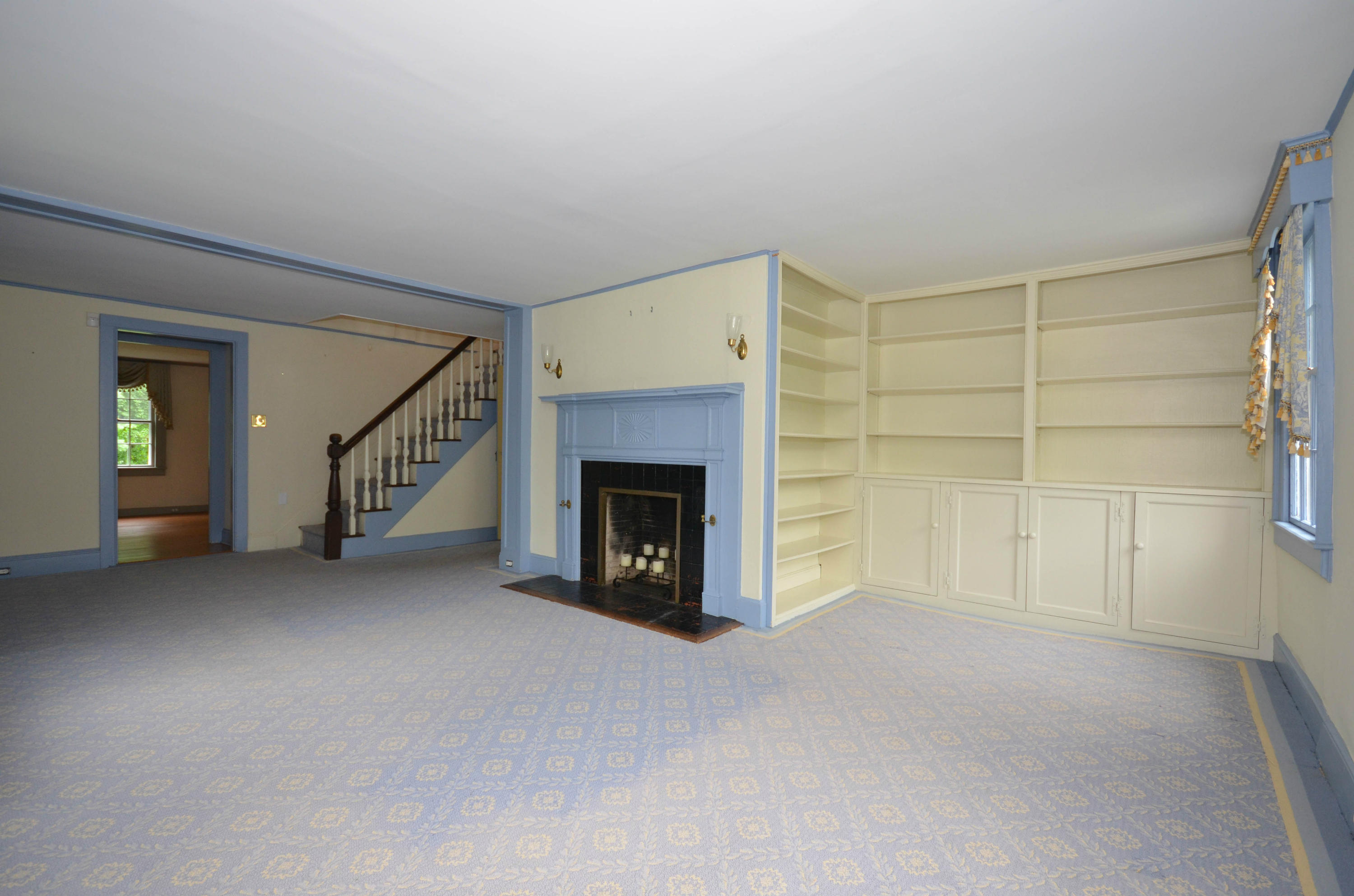 1462 Oenoke Ridge New Canaan, CT 06840 - Photo 6 of 25 an empty room with a fireplace and window
