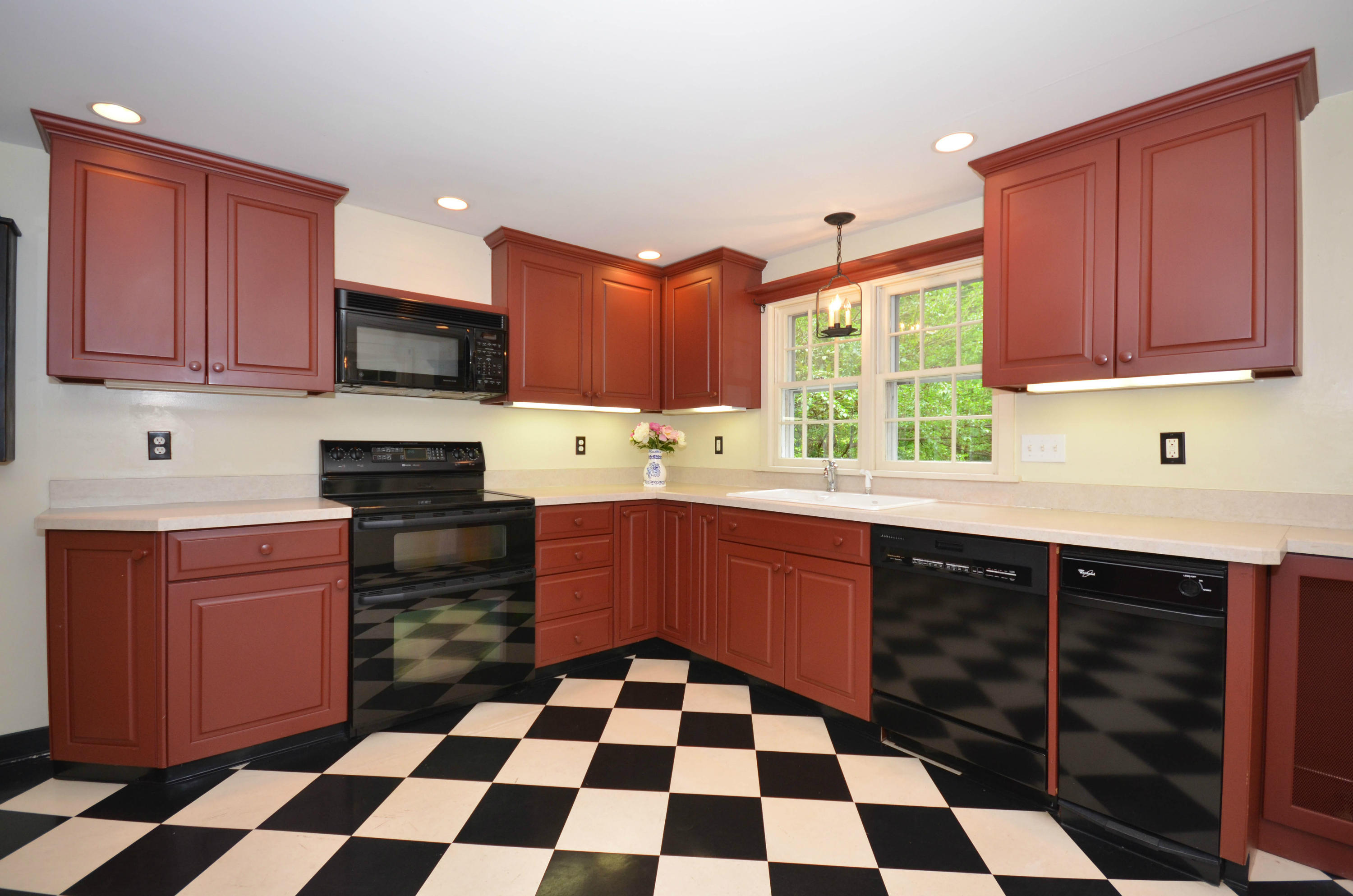 1462 Oenoke Ridge New Canaan, CT 06840 - Photo 10 of 25 a kitchen with stainless steel appliances a sink stove top oven and cabinets