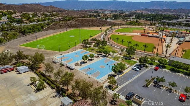 an aerial view of a city with mountains
