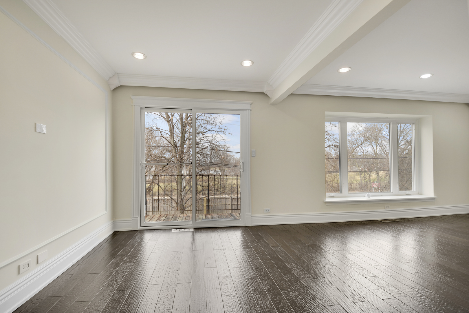 491 Old Surrey Road, Unit B Hinsdale, IL 60521 - Photo 11 of 29 an empty room with wooden floor and windows