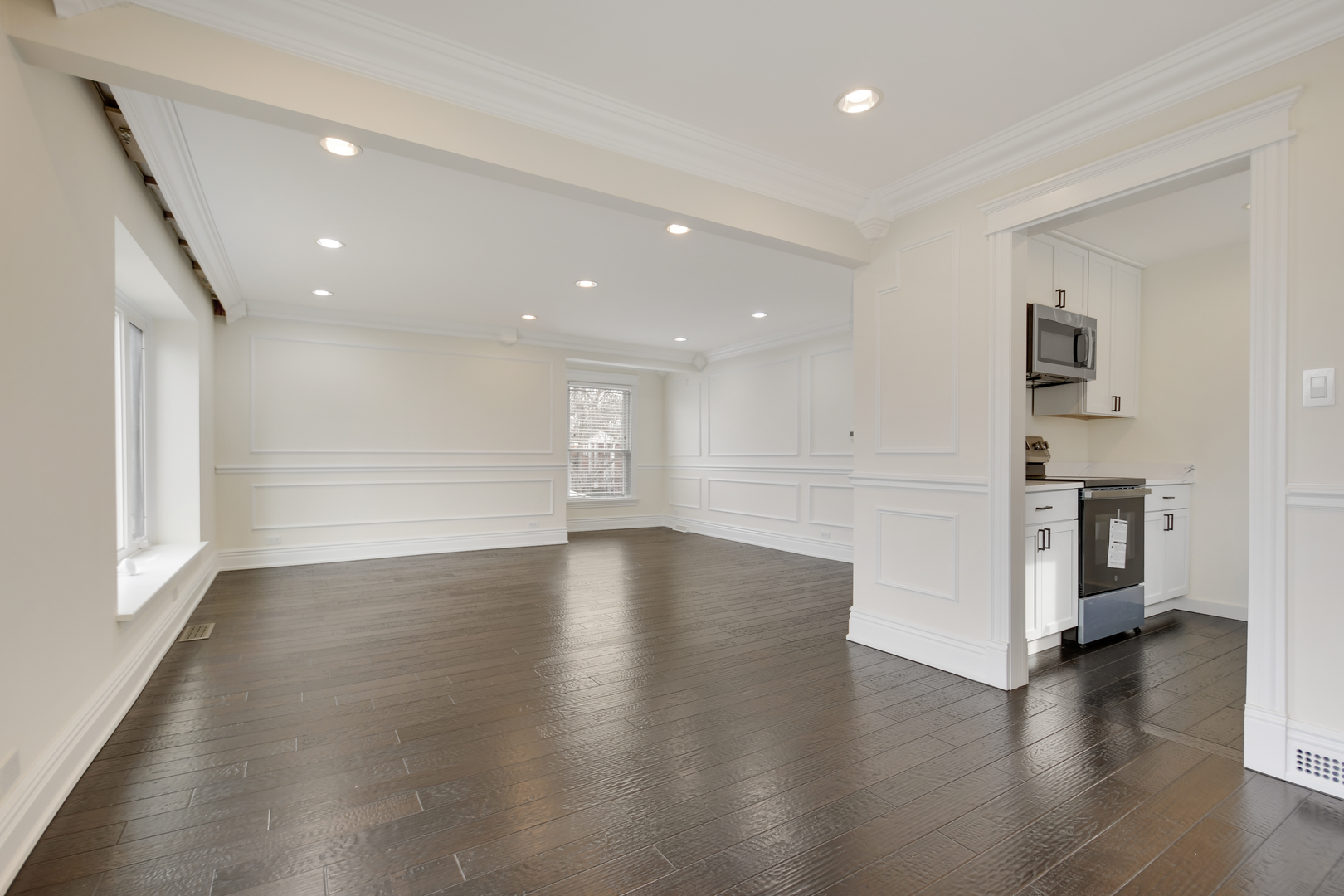 491 Old Surrey Road, Unit B Hinsdale, IL 60521 - Photo 12 of 29 a view of a big room with wooden floor and windows