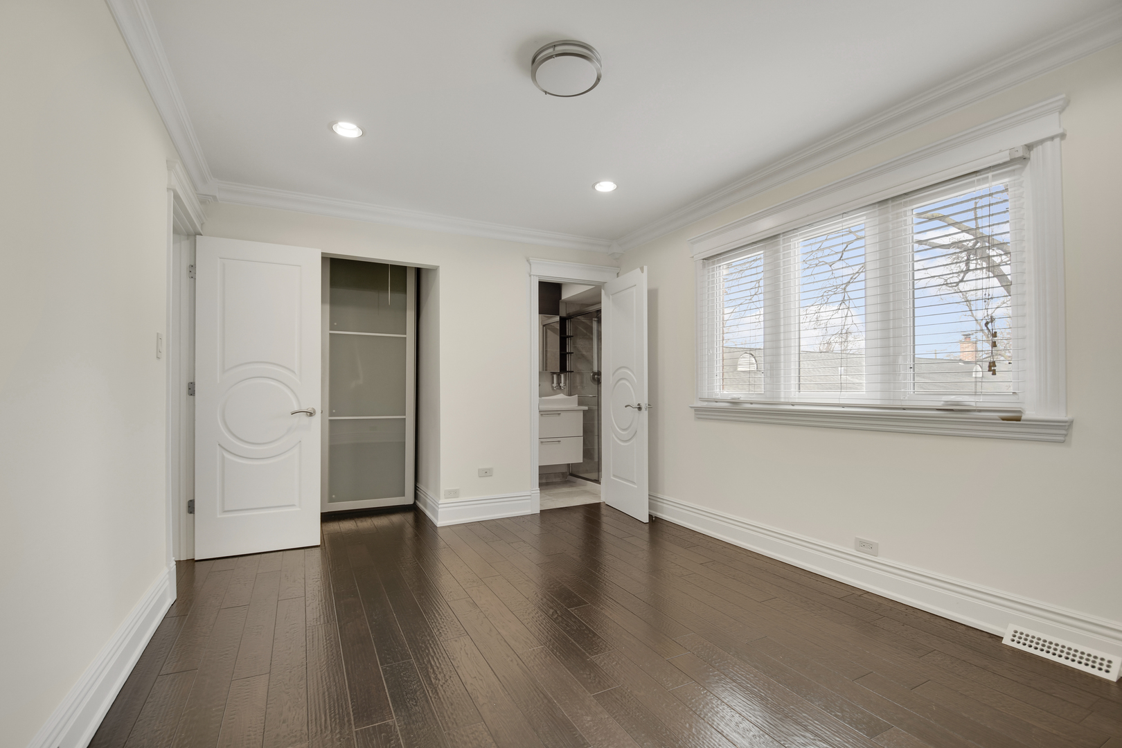 491 Old Surrey Road, Unit B Hinsdale, IL 60521 - Photo 18 of 29 an empty room with wooden floor and windows