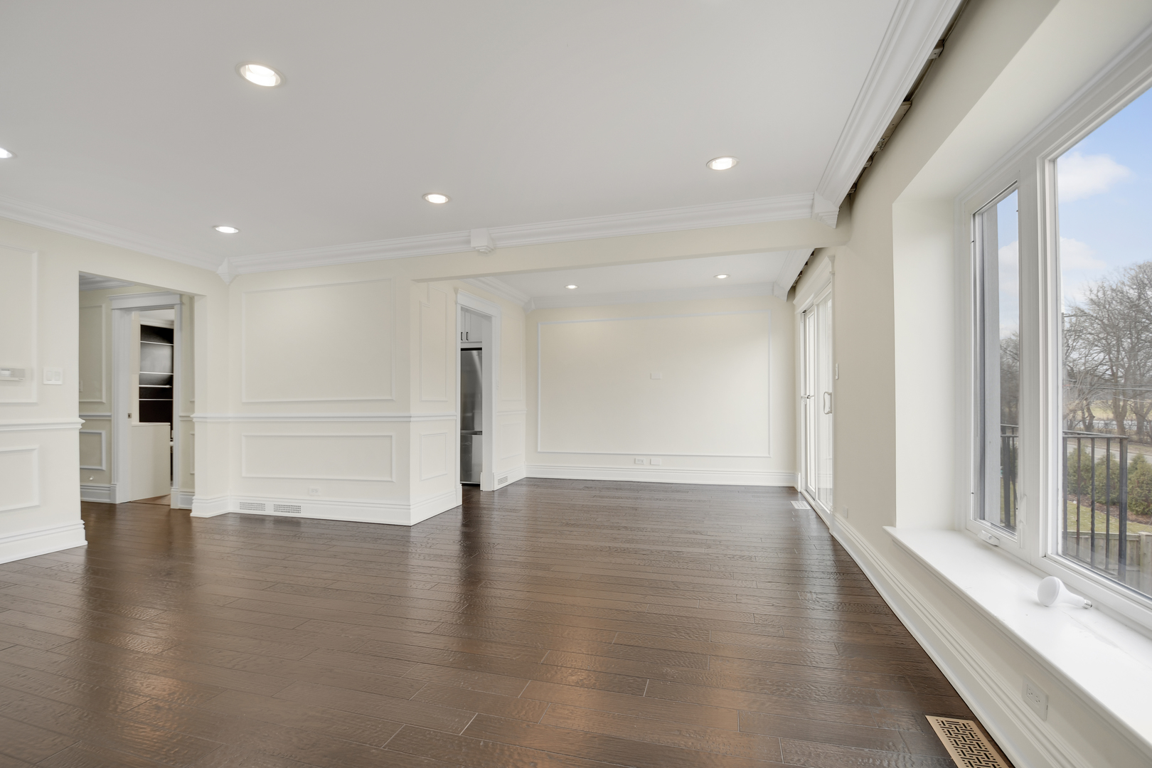 491 Old Surrey Road, Unit B Hinsdale, IL 60521 - Photo 8 of 29 a view of an empty room with wooden floor and a window