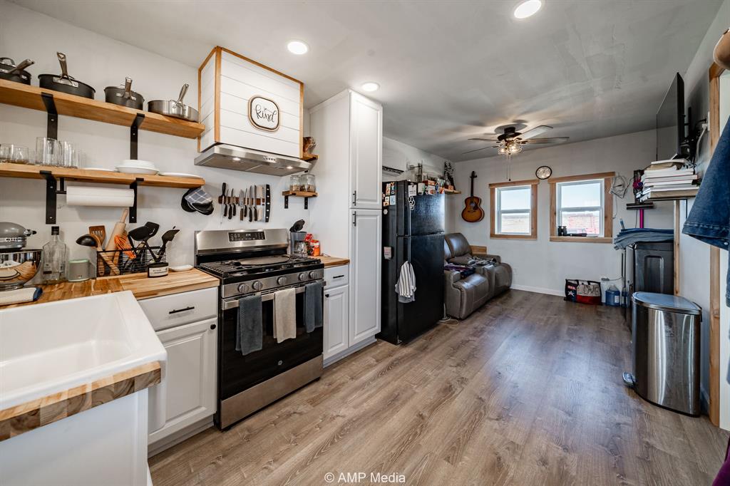 13558 A County Road 440 Merkel, TX 79536 - Photo 5 of 26 a kitchen with a refrigerator and a stove top oven