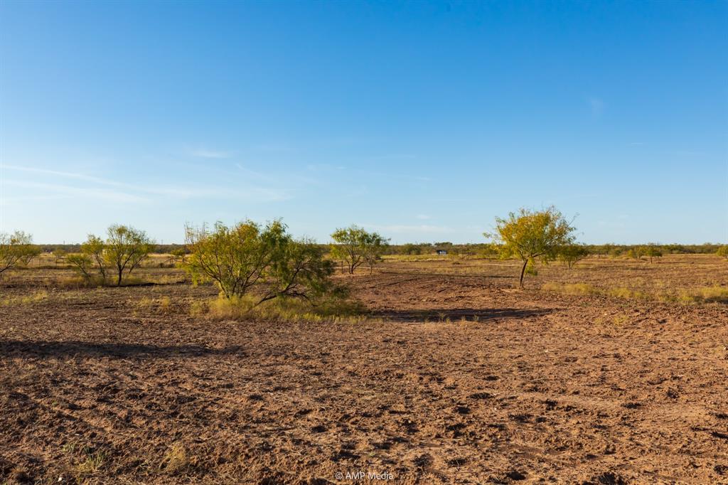 13558 A County Road 440 Merkel, TX 79536 - Photo 9 of 26 a view of a large body of water with a building in the background
