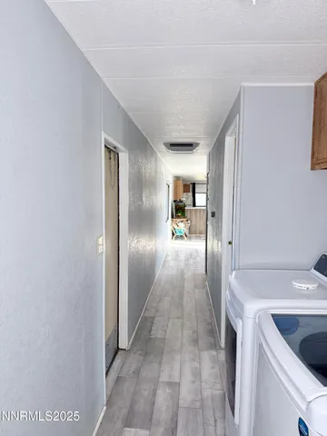 a bedroom with a bed and a mirror