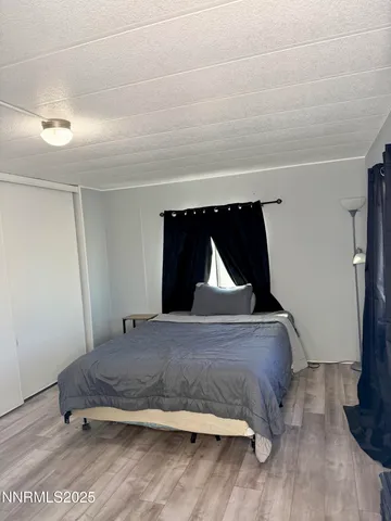 a bath tub sitting next to a white toilet and a shower